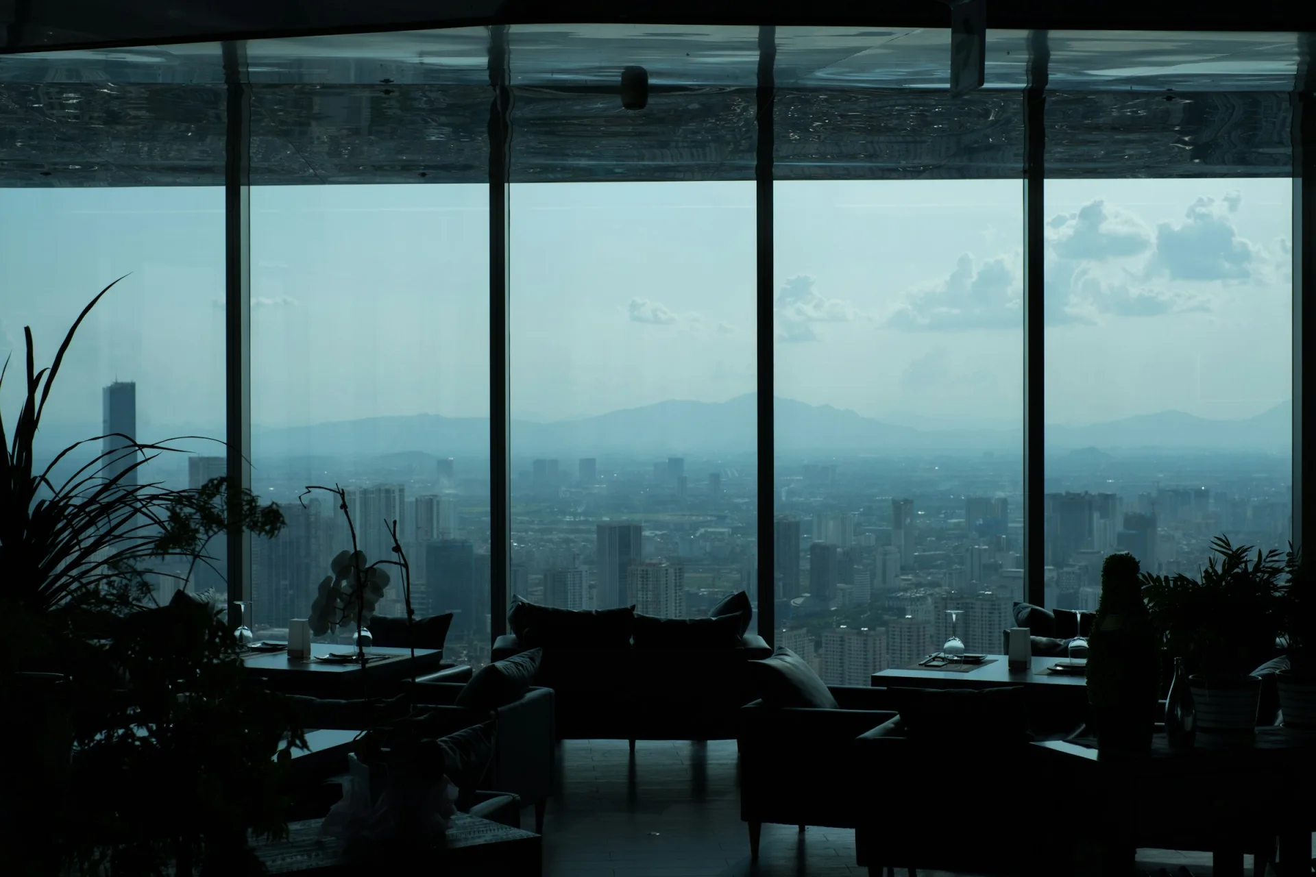 Modern branded-residence interior with full-height glazing — editorial hero